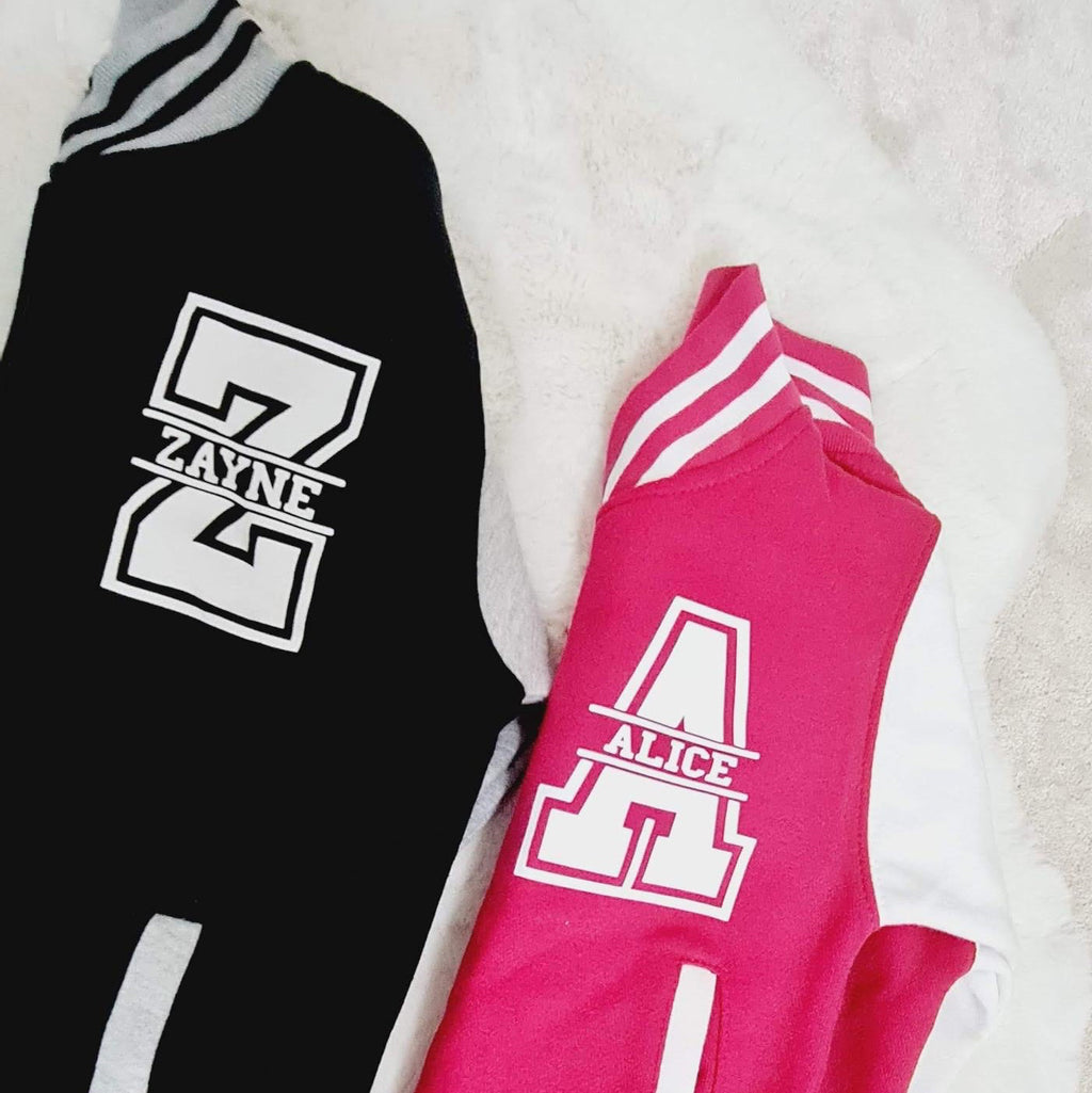 Black and pink tracksuit with logo on a light background