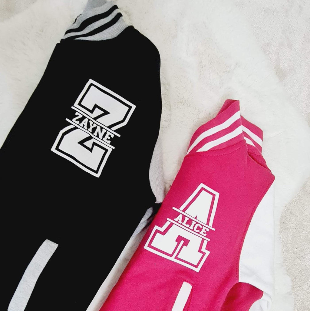 Black and pink socks with a logo on a light background