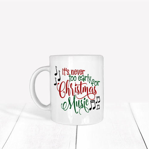 White mug with Christmas-themed text and music notes on a white background