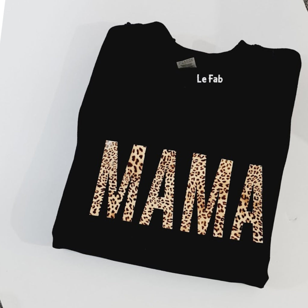 Black sweatshirt with 'MAMA' in leopard print on a white background