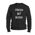 Black sweatshirt with 'STRESSED BUT BLESSED' text on a white background
